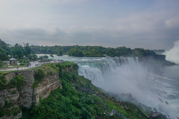 Wall Mural - Niagara Falls, NY: Tourists on Prospect Point get a close up view of the American Falls.