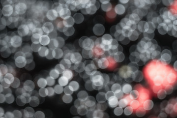Fototapete - Beautiful white and red bokeh on a black background.