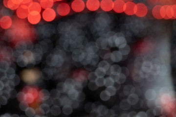 Fototapete - Beautiful white and red bokeh on a black background.