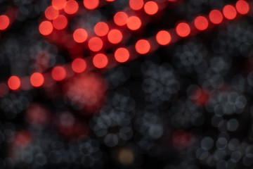 Aufkleber - Beautiful white and red bokeh on a black background.