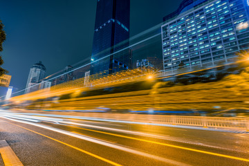 Wall Mural - Vehicle light trails in city at night.