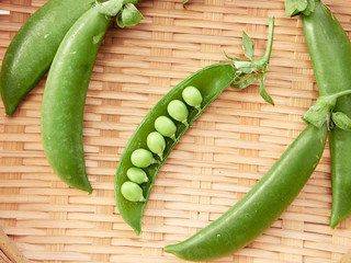 green pea pod In a bamboo container