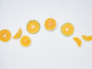 Wall Mural - Sliced ​​oranges on a white background