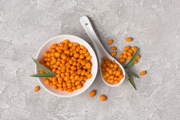 Wall Mural - Fresh ripe sea buckthorn berries in white bowl