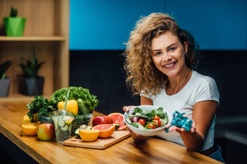 Wall Mural - Fit girl, model holding bowl with fresh salade, healthy eat time.