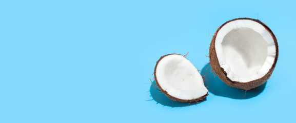 Fresh juicy coconut isolated on a blue background. Concept of Healthy eating and dieting. Travel and holiday concept. Copy space. Free space for your text