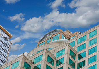 Canvas Print - Green Windows in Building on a Blue Sky