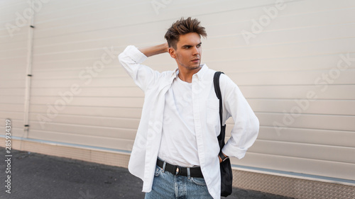 Young European Man With A Hairstyle In A Fashionable Shirt In Blue