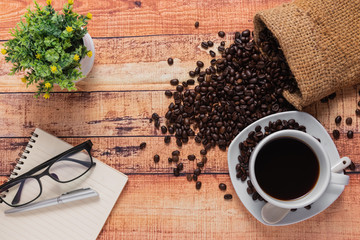 top view, cup of coffee on wood table. Flat lay concept