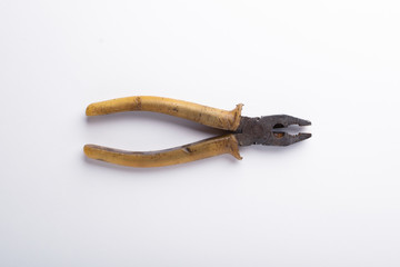 old pliers on a white background