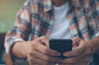 © tippapatt - Man using smartphone