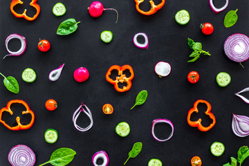 Wall Mural - colorful vegetables pattern for cooking design on black background top view