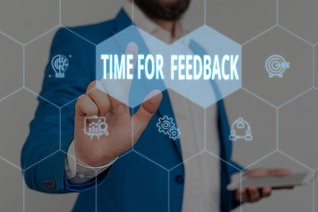 Text sign showing Time For Feedback. Business photo showcasing information about reactions to a product or services Male human wear formal work suit presenting presentation using smart device