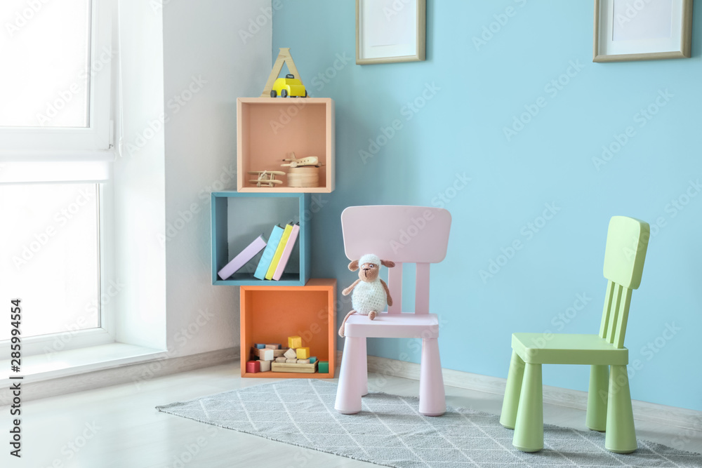 Stylish interior of modern playroom in kindergarten
