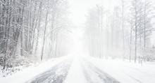 Snowy Winter Road During Blizzard In Latvia