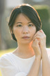 © Kenishirotie - Portrait young Asian woman outdoor back light in spring or summer