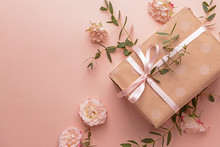 Gift Box And Beautiful Flowers On Color Background