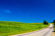 © Don Landwehrle - Rural road with a cornfield.