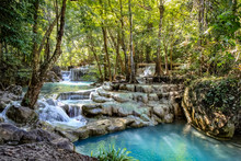 Smooth Rocks With Cascading Water Make A Series Of Beautiful Short Waterfalls In The Dense Forest Of Erawan National Park In Thailand Look Staged