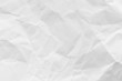 © phanthit malisuwan - White crumpled recycled paper texture background for business communication and education design.