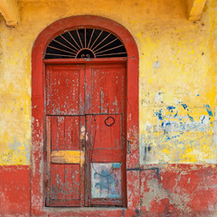 Wall Mural - Vintage wooden door in the historic city center of Panama City, also known as Casco Antiguo and Casco Viajo or Old Quarter, Panama.