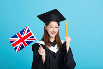 happy Young female graduation student showing the United Kingdom   flag