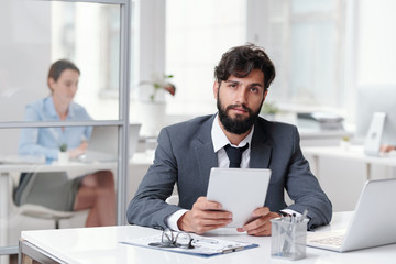 Poster - Handsome Bearded Businessman Sitting at Desk