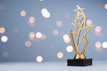 modern championship trophy with three gold stars