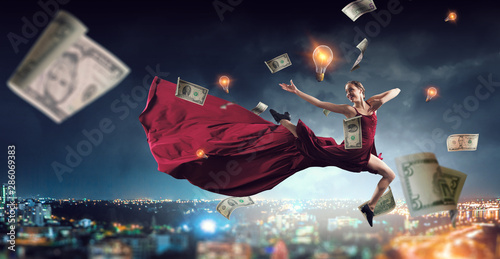 Young and beautiful female dancer in a red dress