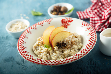 Wall Mural - Oatmeal porridge with apple and spices