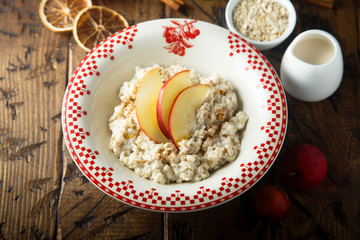 Wall Mural - Oatmeal porridge with apple and spices