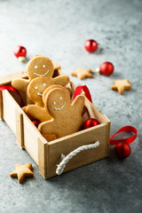 Wall Mural - Homemade gingerbread men in wooden box