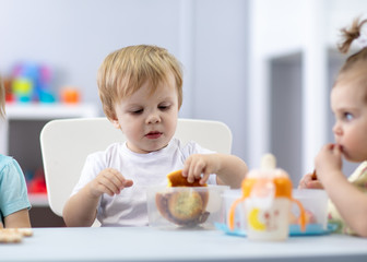 Wall Mural - Babies have pause to eat in kindergarten or daycare