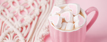 Cup Of Hot Chocolate With Pink Heart Shaped Marshmallows And Macrame Panel On Pink Background, Trendy Minimal Romantic Composition, Saint Valentine Morning, Banner