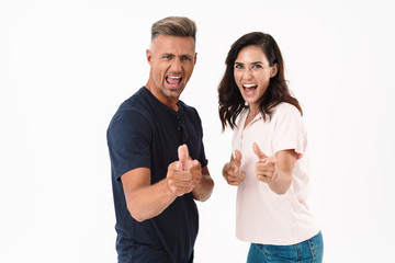 Wall Mural - Cheerful couple wearing casual outfit standing isolated