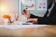 © chaiwat - Asian business woman checklist Business graph at home office.,Concept to checklist.