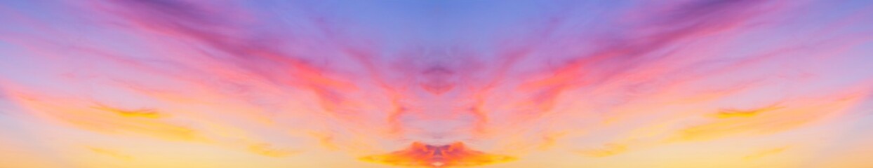Wall Mural - collage with a horizontal reflection of the panorama of the sunset sky with pink layered clouds. nat