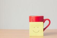 Red Mug With Smile Face On Paper Sticky Note With Copy Space.coffee Is Always A Good Idea.