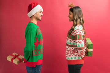 Wall Mural - Hispanic Man And Woman Giving Surprise Presents