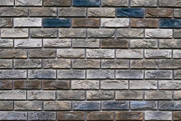 Wall Mural - Vintage multi-colored bricks background, grunge texture. Old weathered brick wall. Decorative tile surface. Rough brickwork.