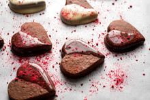Close Up Of Heart Shaped Chocolate Dipped Valentines Cookies