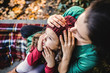 © Halfpoint - A young mother with a toddler daughter sitting in forest in autumn nature.