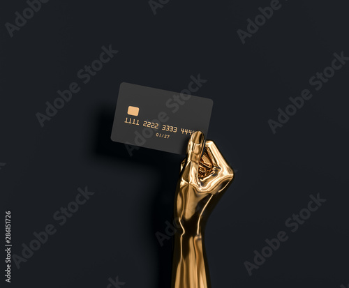 Fotomural Abstract Gold hand sculpture holding credit card, The best banking offer for VIP customers