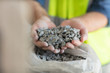 © Westend61 - Worker holding gravel
