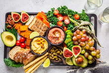Vegan Appetizer Platter. Hummus, Tofu, Vegetables, Fruits And Bread On Black Tray.