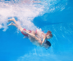 family  in swimming pool