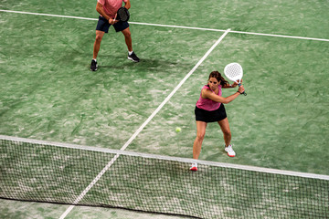 Wall Mural - mixed padel match in a padel court indoor