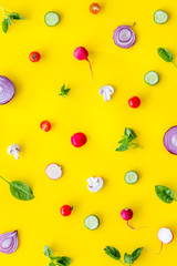 Wall Mural - Layout of colorful vegetables on yellow background top view pattern