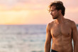 © Maridav - Beach body fit handsome man with six pack abs shirtless on summer Hawaii vacation sunset. Surfer lifestyle.