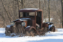 Old Rusted Car Body In Winter Scene
